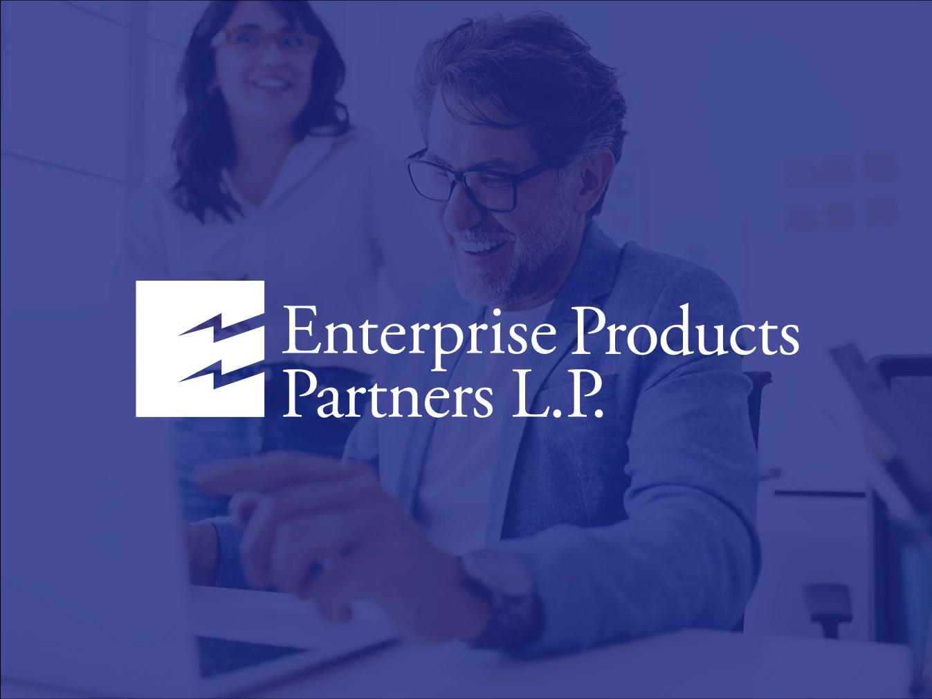 Logo for Enterprise Products Partners, a Business Wire customer, overlayed on an image of two people collaborating on a laptop