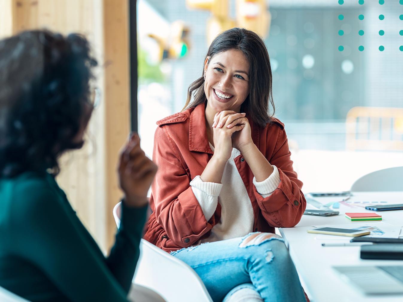 woman smiling in a meeting