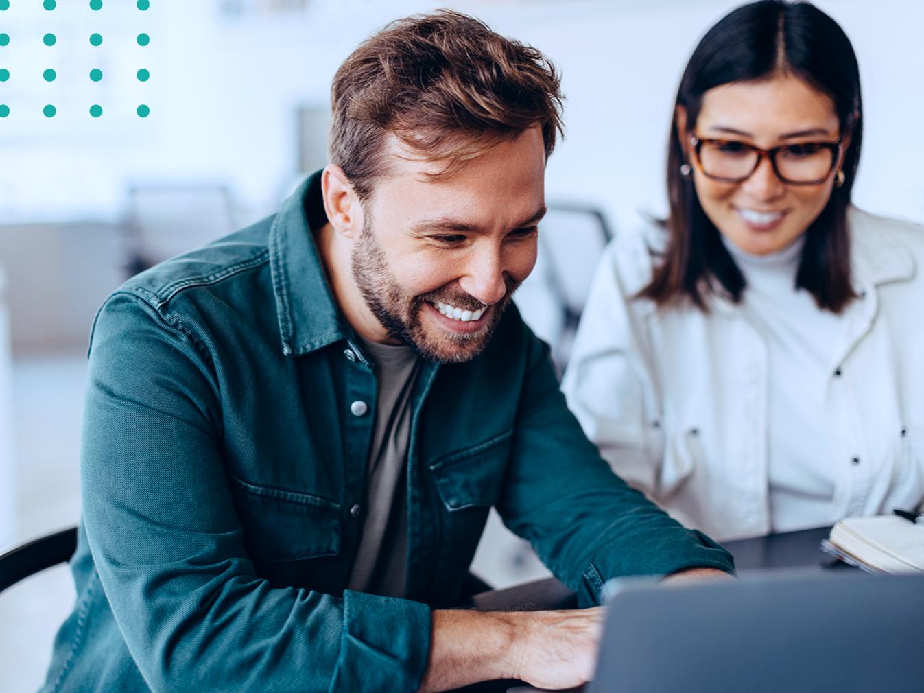 man and woman collaborating at a laptop