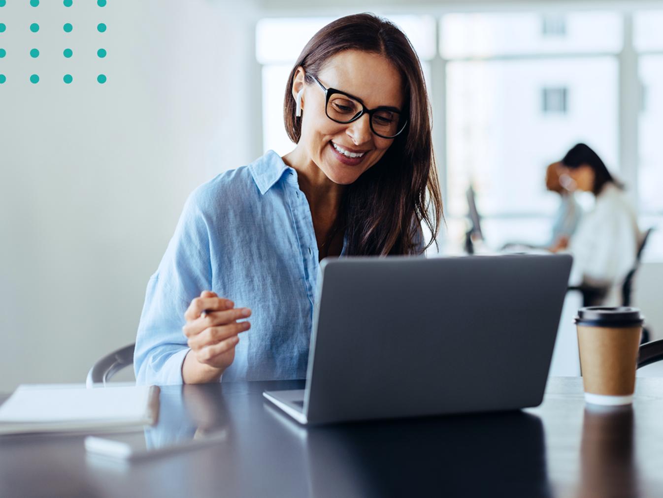 woman working on a laptop at an office